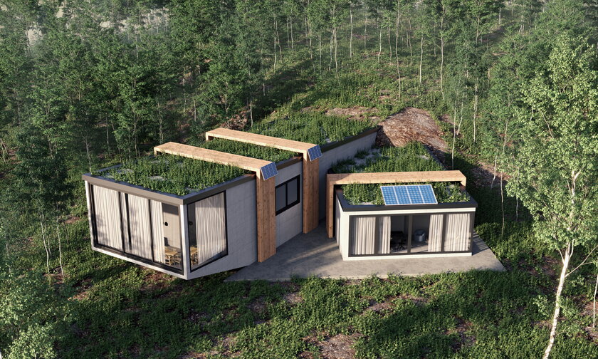 Nachhaltiger Neubau inmitten von Wald mit begruentem Flachdach und Sonnenkollektoren.